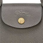 Lieblingstasche Epure XS grey leather crossbody bag with embossed horse logo and gold button closure.