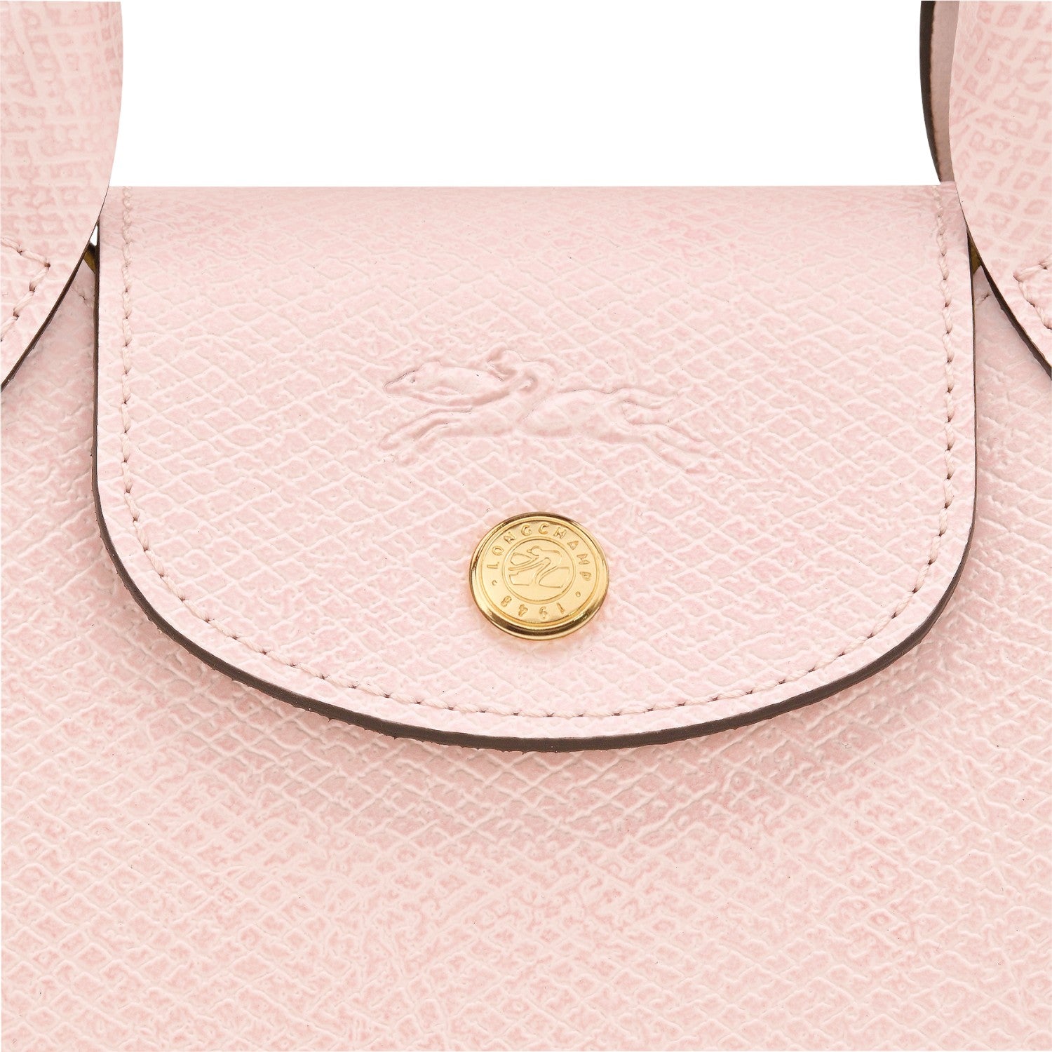 Lieblingstasche Epure XS light pink textured leather crossbody bag with embossed horse logo and gold hardware.