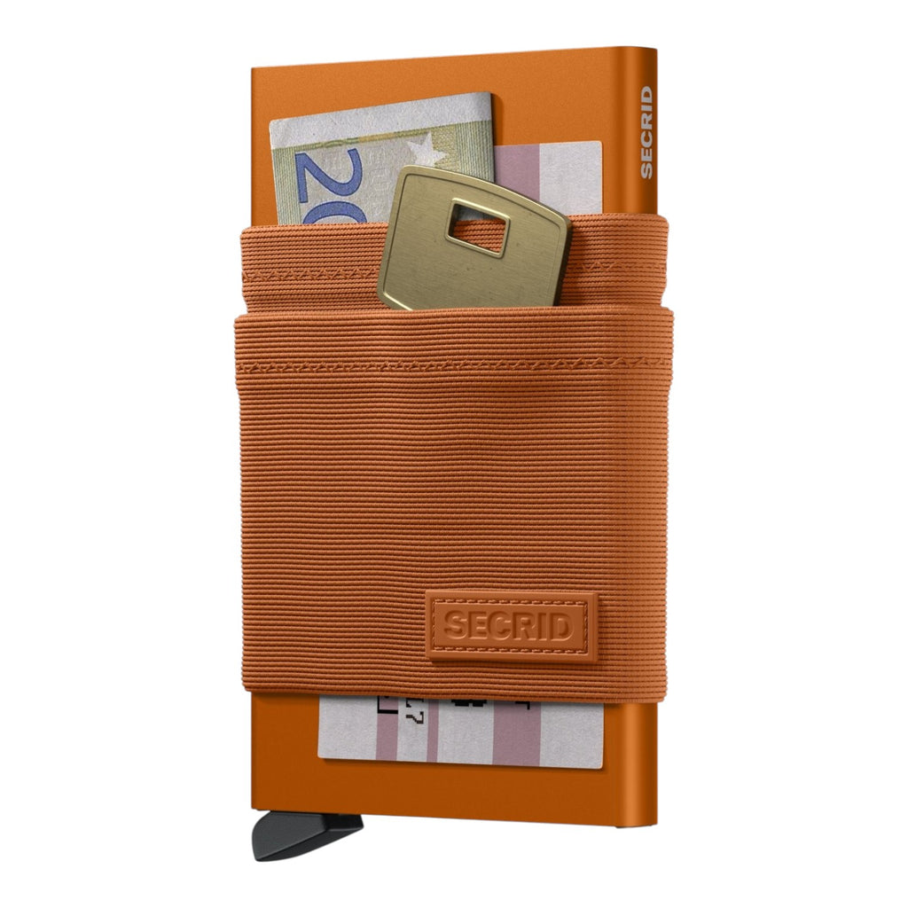 Lieblingstasche Flexwallet orange card protector with elastic textile sleeve holding cards, cash, and a key.