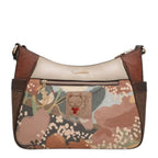 Lieblingstasche cross-body bag featuring a multi-colored floral print, brown leather accents, and a cat logo patch.