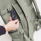 Lieblingstasche GOT BAG Rolltop 2.0 backpack in sage green with a hidden zippered back pocket for smartphone storage