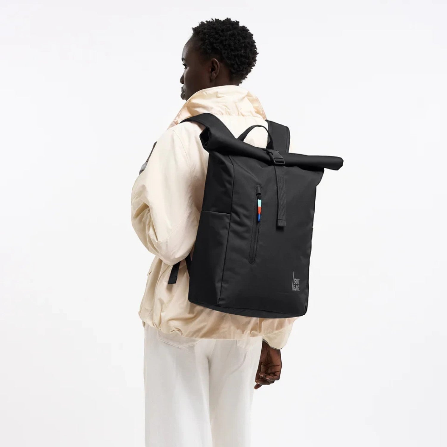 Lieblingstasche GOT BAG Rolltop Easy backpack in black worn by a model against a white background