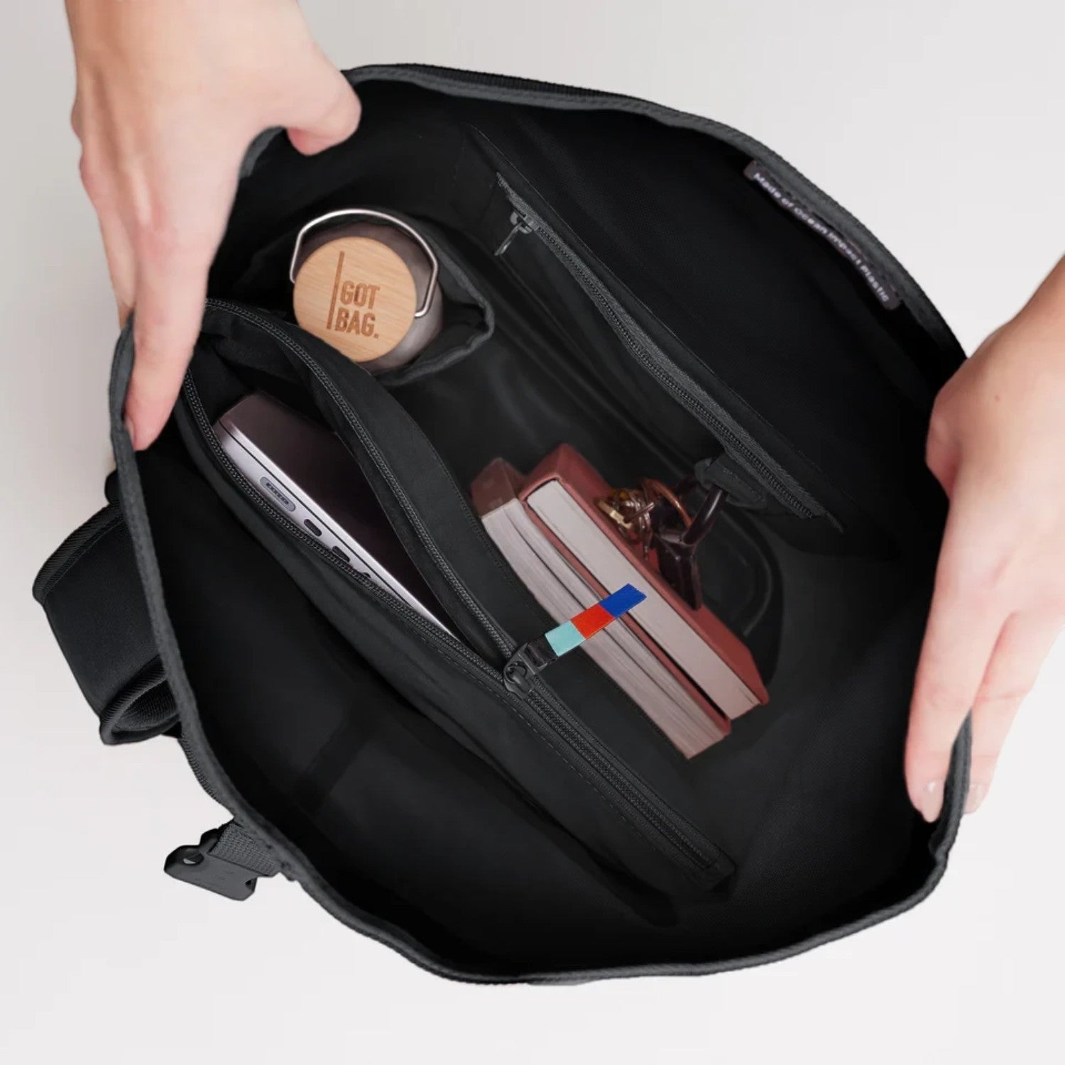 Lieblingstasche GOT BAG Rolltop 2.0 backpack interior showing laptop sleeve, water bottle, and organized compartments.