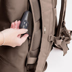 Lieblingstasche GOT BAG Rolltop Lite 2.0 backpack in taupe showing the secure zippered back pocket with a smartphone