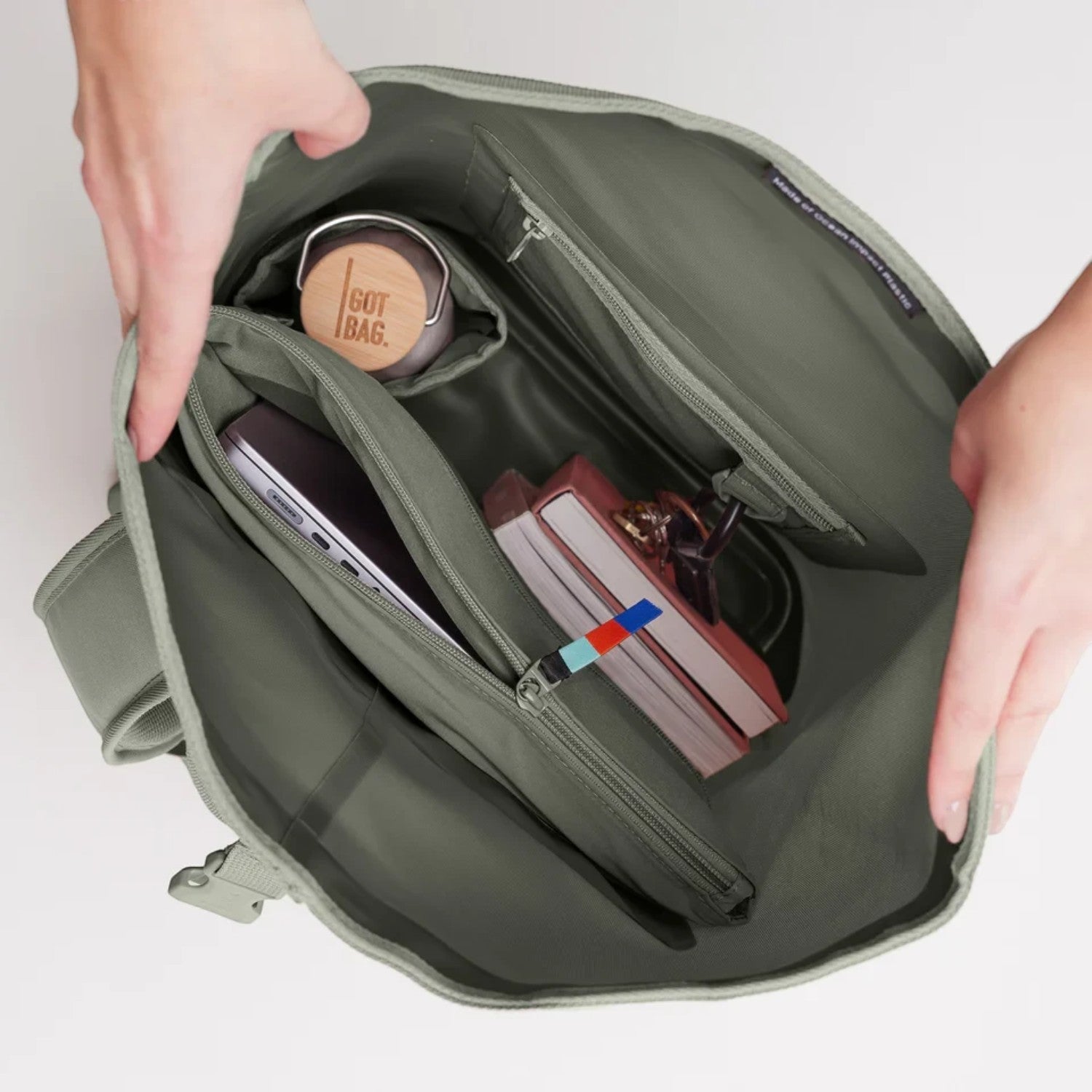 Lieblingstasche GOT BAG Rolltop Lite 2.0 backpack interior showing laptop sleeve, bottle holder, and organized pockets.