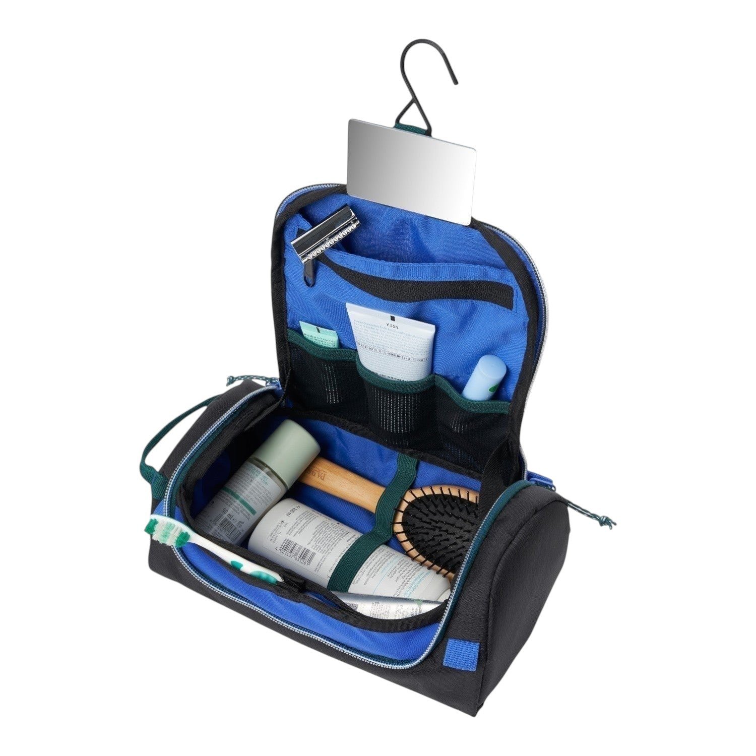 Lieblingstasche black and blue hanging wash pack filled with toiletries, featuring a mirror and internal pockets.