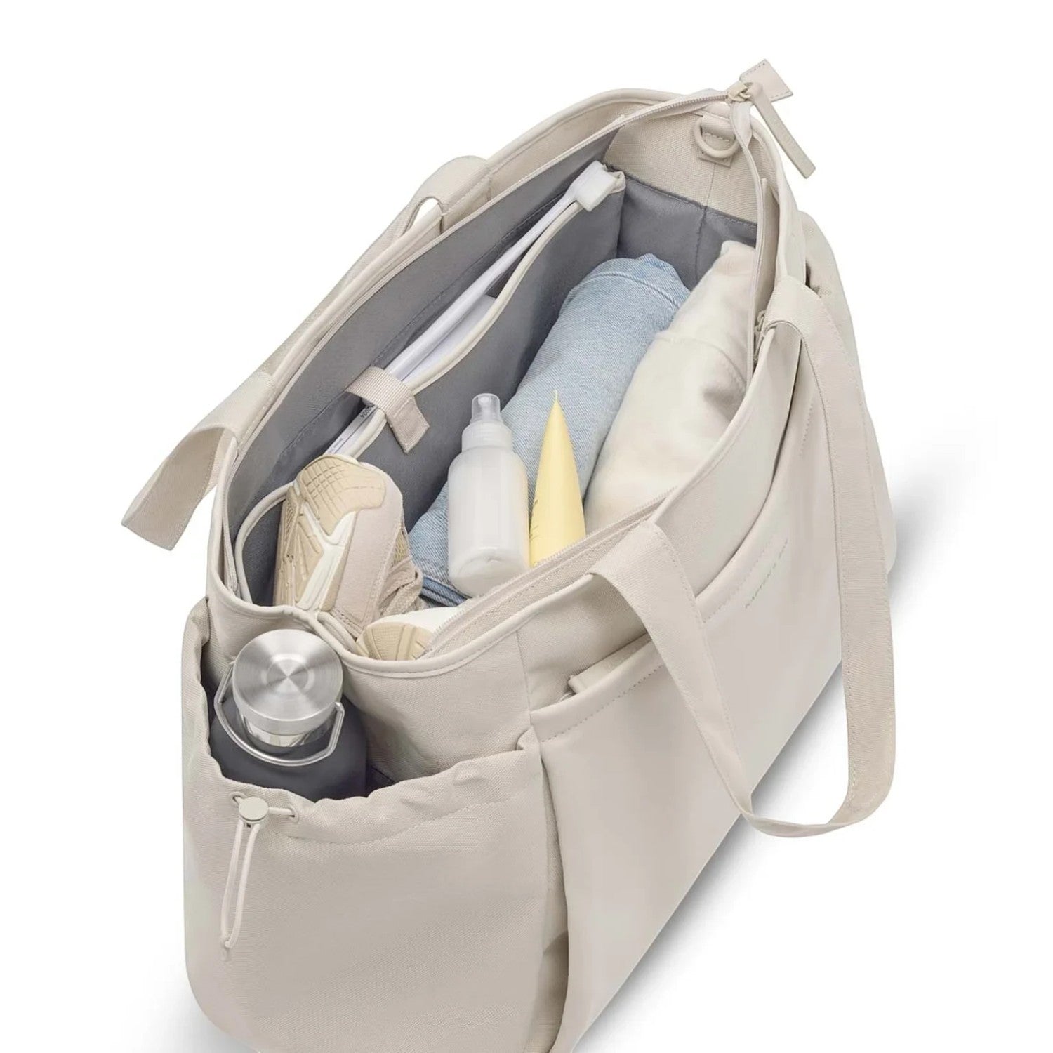 Lieblingstasche Hellvi Pro Large beige tote bag with organized interior compartments, water bottle, and accessories.