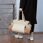 Lieblingstasche Hellvi Pro Large beige tote bag with yoga mat holder and side pockets carried by a person