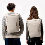 Lieblingstasche Helsinki beige rolltop backpack worn by a man and woman showing front and back views