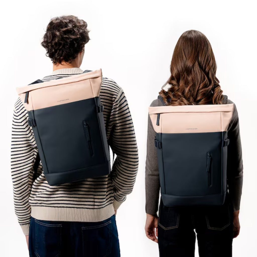 Lieblingstasche Helsinki rolltop backpack in beige and dark grey worn by a man and woman on a white background