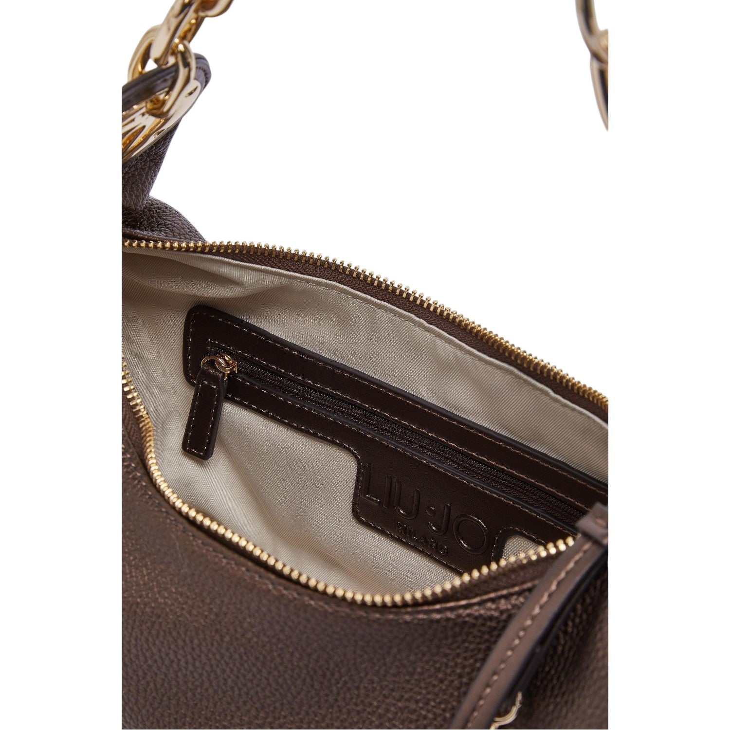 Lieblingstasche ECS Hobo S bag interior featuring a zippered pocket, beige lining, and gold-tone hardware details.