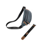 Lieblingstasche a/u by aunts & uncles Ichikawa belt bag in grey coated canvas with brown leather details and black strap.