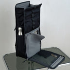 Lieblingstasche Kapten & Son Lund Pro black backpack with open flap, side bottle pocket, and laptop compartment access