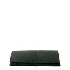 Lieblingstasche Keeper Etui in dark green leather with a slim blue elastic band closure on a white background.