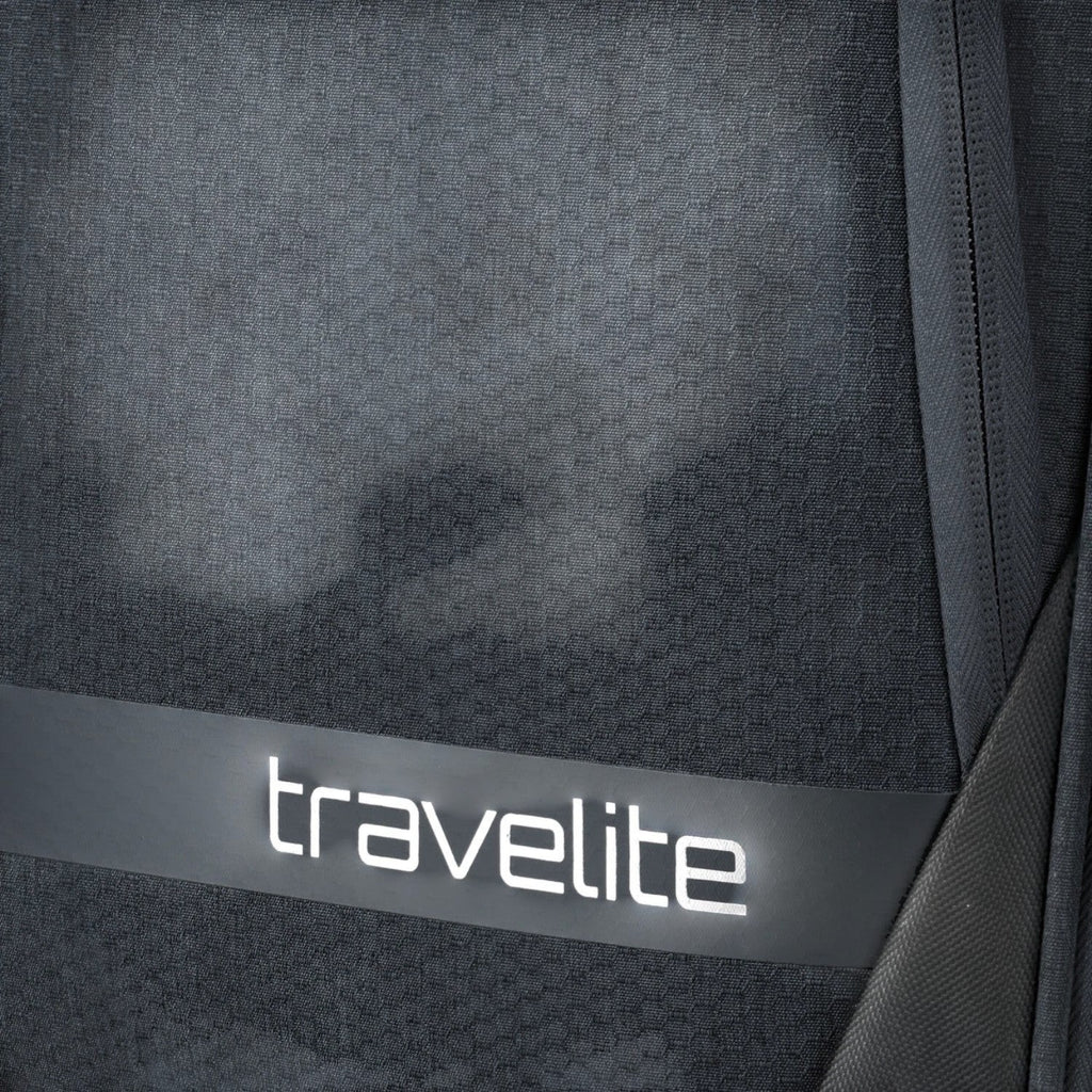 Close-up of the dark grey textured fabric on a Lieblingstasche KICK OFF trolley suitcase with travelite branding.