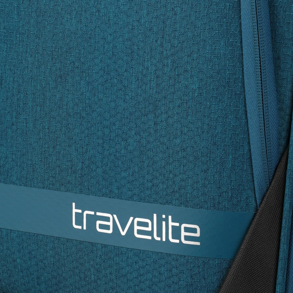 Close-up of the Lieblingstasche KICK OFF trolley suitcase in petrol blue featuring the travelite logo