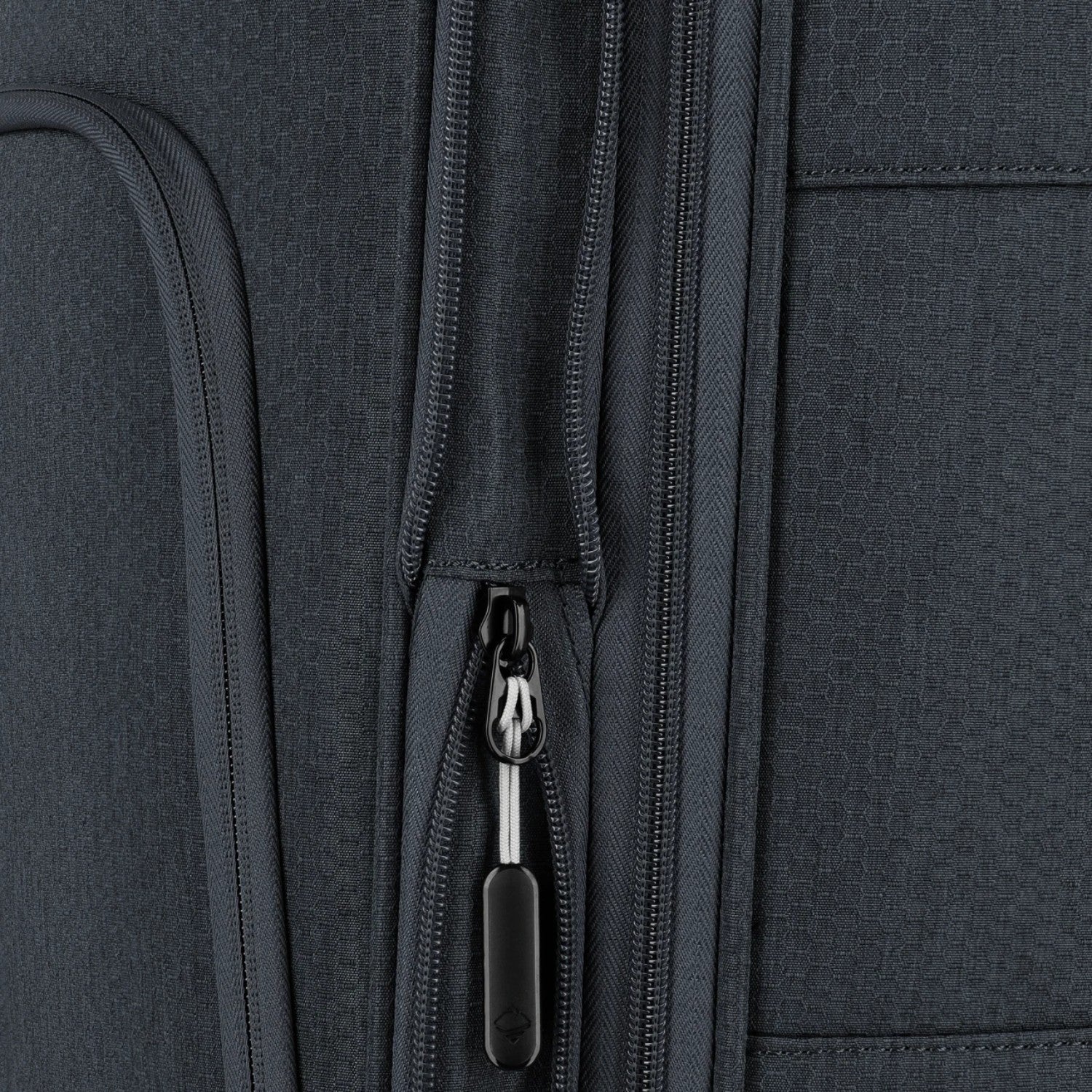 Close-up of the dark grey fabric and zipper detail on a Lieblingstasche KICK OFF expandable 4-wheel trolley suitcase.
