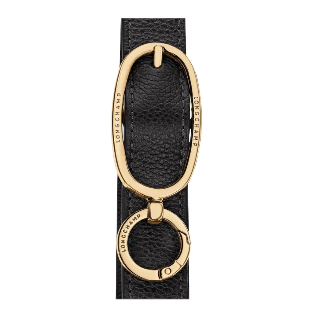 Lieblingstasche Le Foulonné shoulder bag detail featuring a gold-toned metal oval hardware clasp on black leather