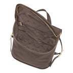 Lieblingstasche Le Foulonné Rucksack in brown pebbled leather with multiple interior compartments and gold-tone zippers.
