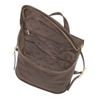 Lieblingstasche Le Foulonné Rucksack in brown pebbled leather with multiple interior compartments and gold-tone zippers.