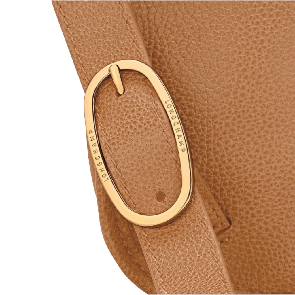 Lieblingstasche Le Foulonné Rucksack in tan pebbled leather with gold hardware and embossed logo.