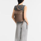 Lieblingstasche Le Foulonné Rucksack in taupe leather with gold zipper and multiple interior compartments.