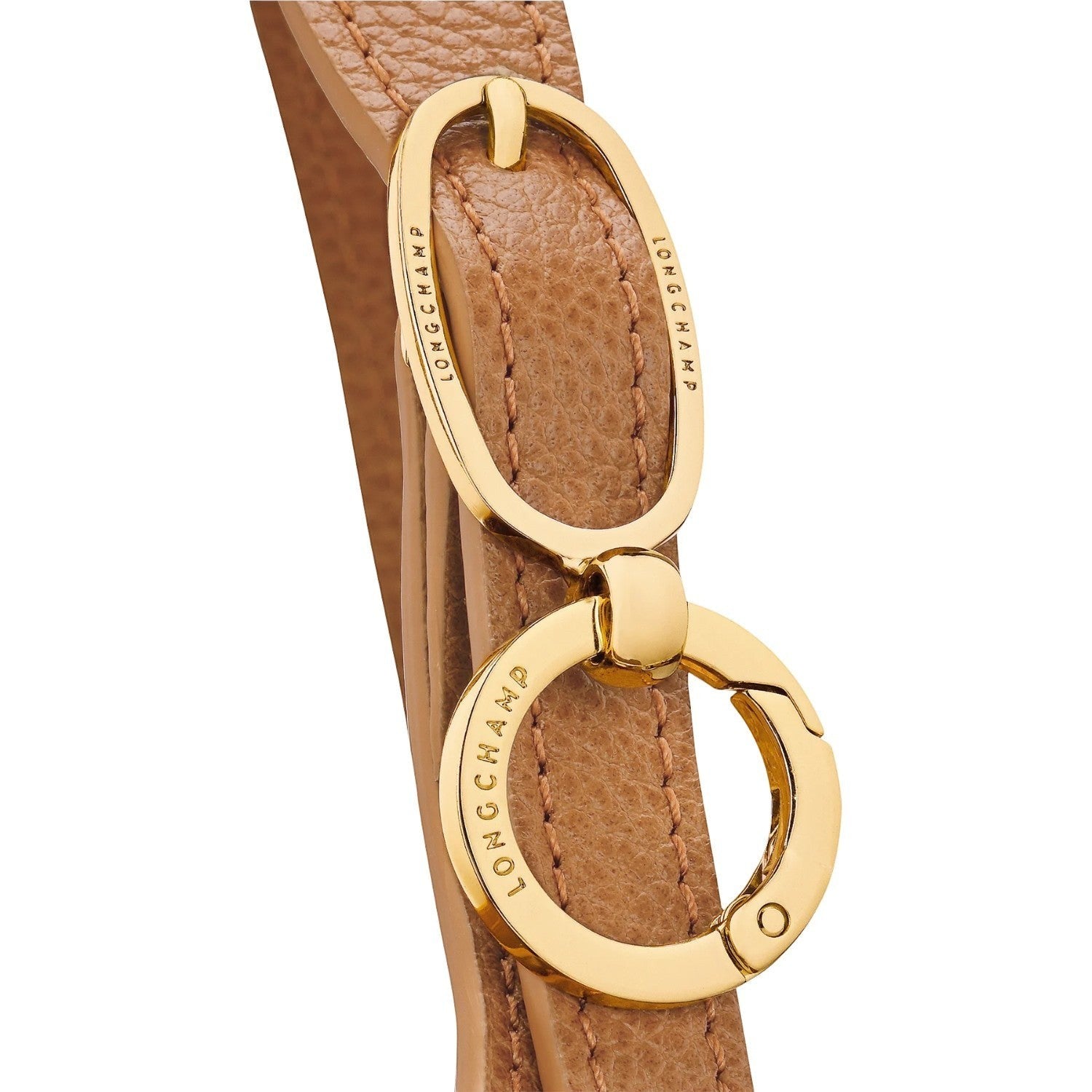 Lieblingstasche Le Foulonné S tan leather handbag strap with gold hardware and embossed logo.
