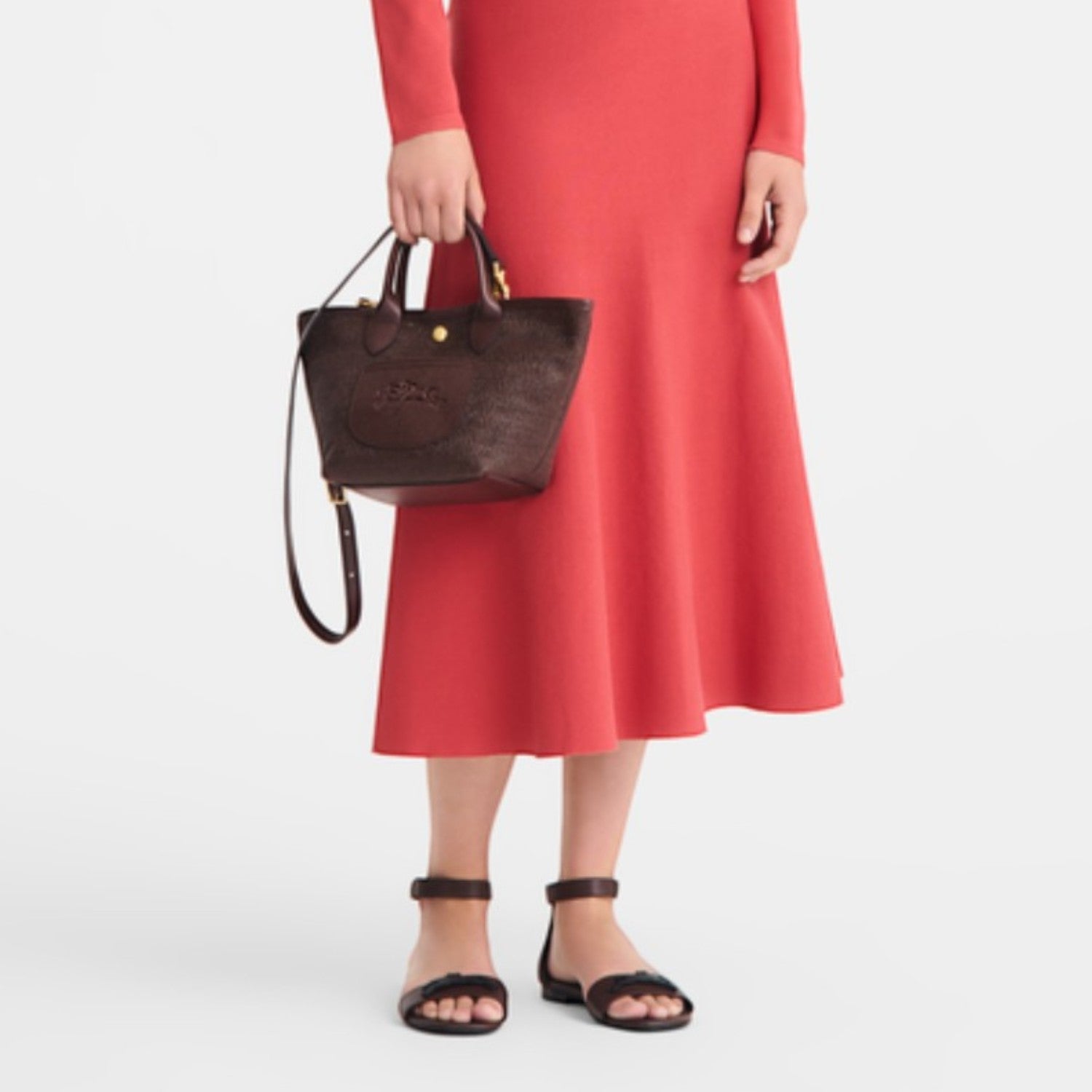 Lieblingstasche Le Panier Pliage XS dark brown embossed leather handbag with top handles and shoulder strap.