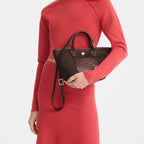 Lieblingstasche Le Panier Pliage XS dark brown woven crossbody bag with leather trim and gold hardware