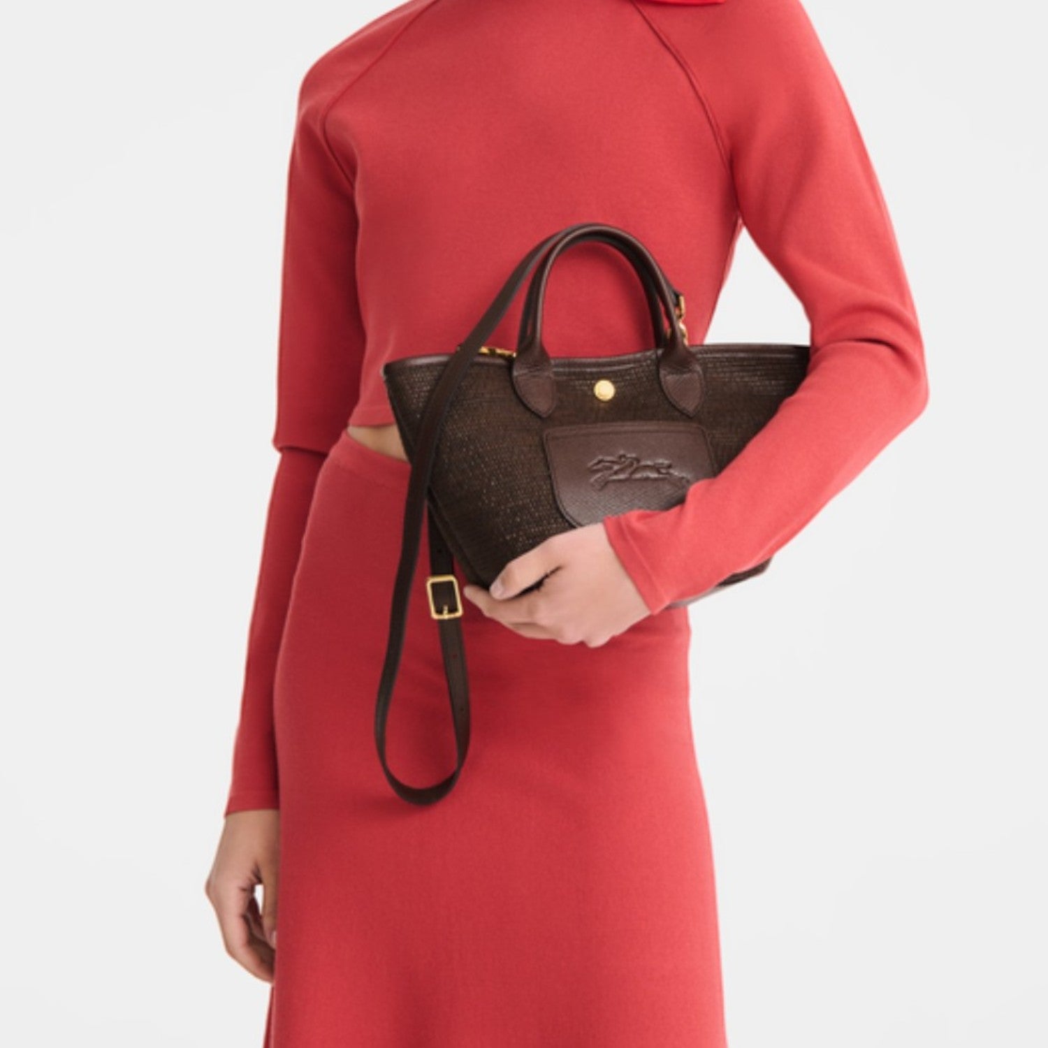 Lieblingstasche Le Panier Pliage XS dark brown woven crossbody bag with leather trim and gold hardware
