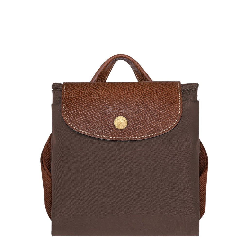 Lieblingstasche Le Pliage rucksack in brown nylon with a textured leather flap and gold-tone snap button closure.