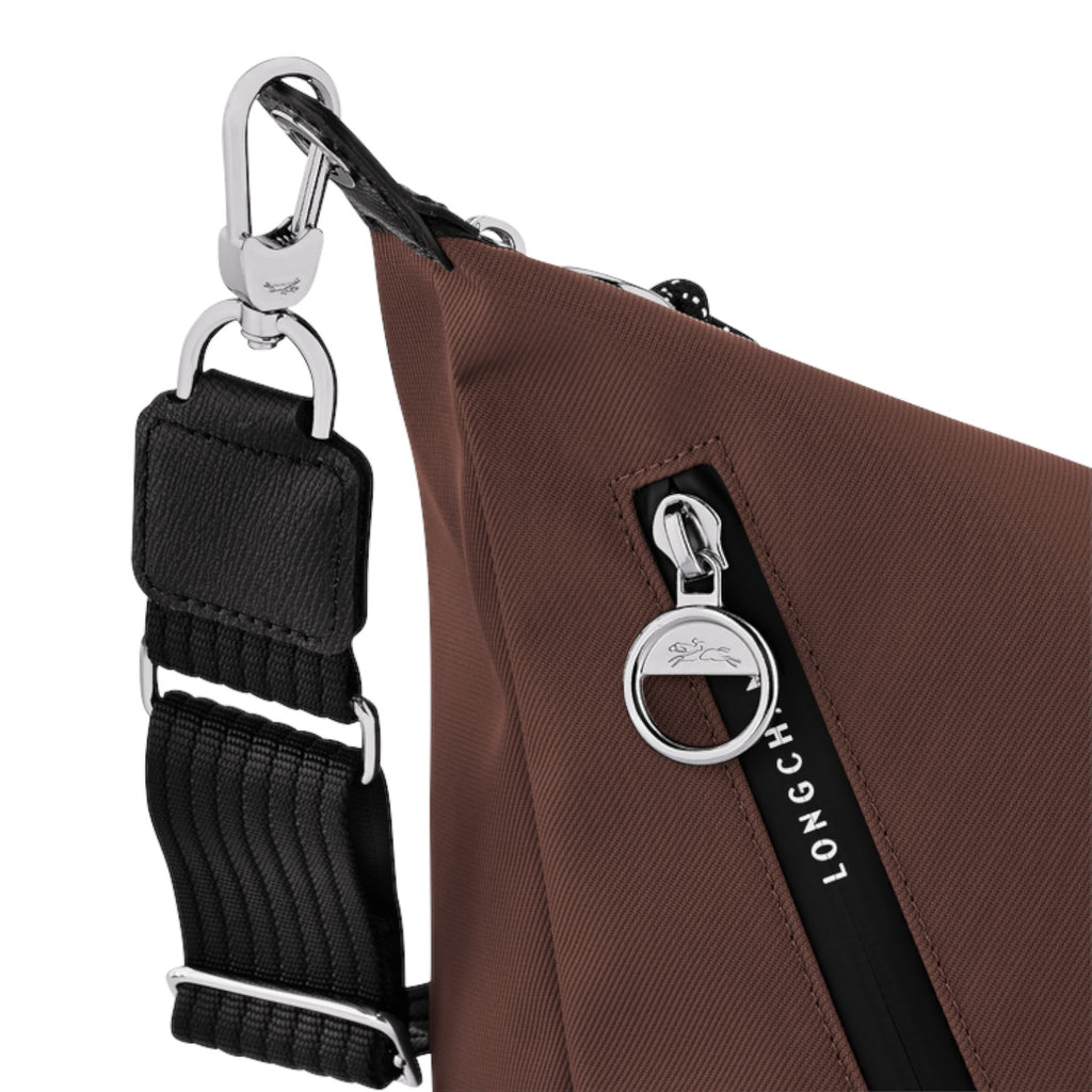 Lieblingstasche Le Pliage Energy brown crossbody bag with silver hardware, black strap, and branded zipper pull