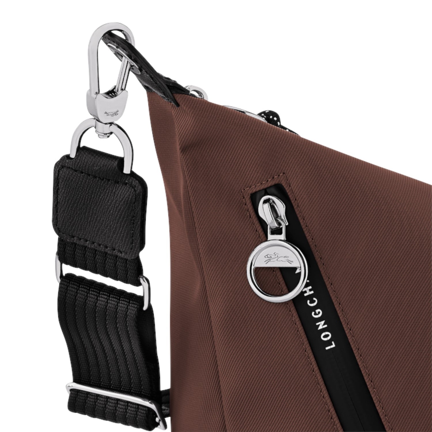 Lieblingstasche Le Pliage Energy brown crossbody bag with silver hardware, black strap, and branded zipper pull