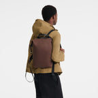 Lieblingstasche Le Pliage Energy Rucksack in brown, a unisex backpack with black straps and top handle.