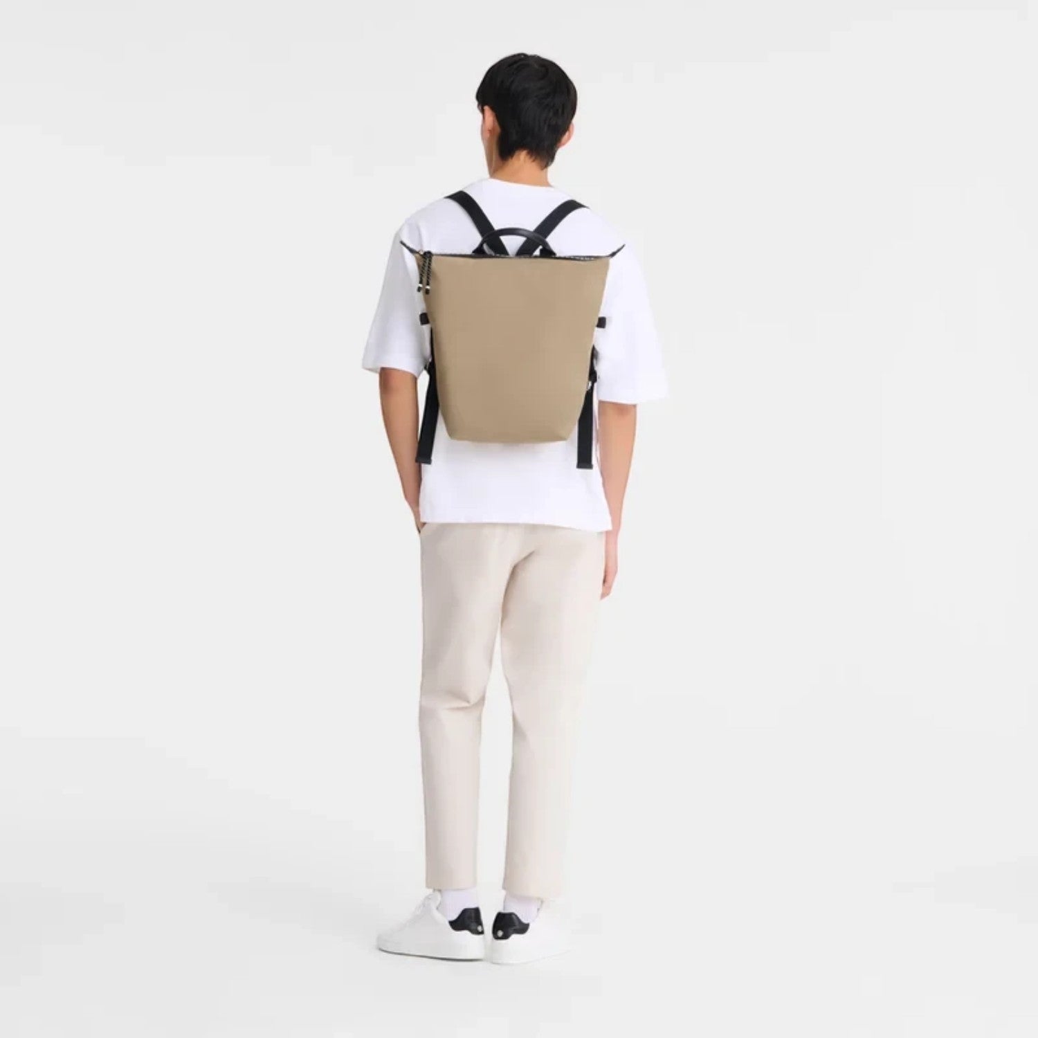 Lieblingstasche Le Pliage Energy Rucksack in tan recycled nylon with adjustable straps. Modern, minimalist style.