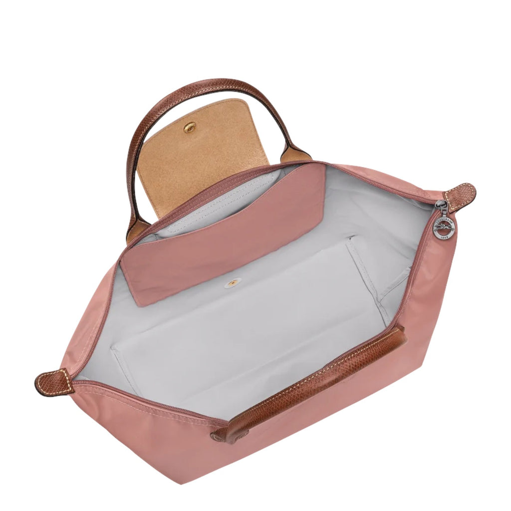 Lieblingstasche Le Pliage L handbag in dusty rose nylon with leather trim and handles. Features a snap closure flap and interior pockets.