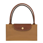 Lieblingstasche Le Pliage L handbag in tan nylon with brown leather trim and handles. Features a snap closure.