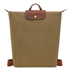 Lieblingstasche Le Pliage rucksack in khaki nylon with brown leather flap, gold snap button, and adjustable straps.