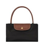 Lieblingstasche Le Pliage L black nylon handbag with brown leather trim and handles.