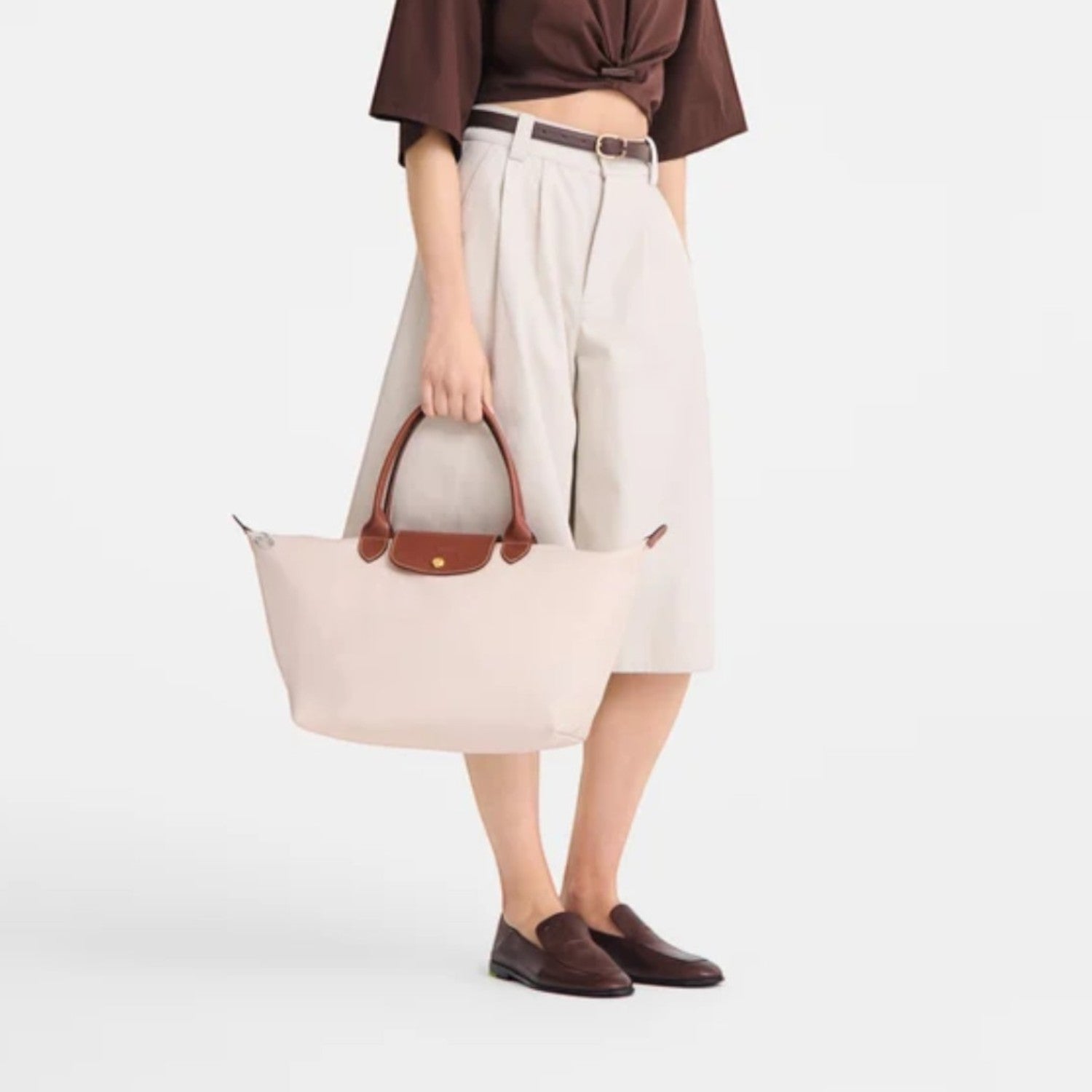 Lieblingstasche Le Pliage L handbag in light beige nylon with brown leather trim and handles.