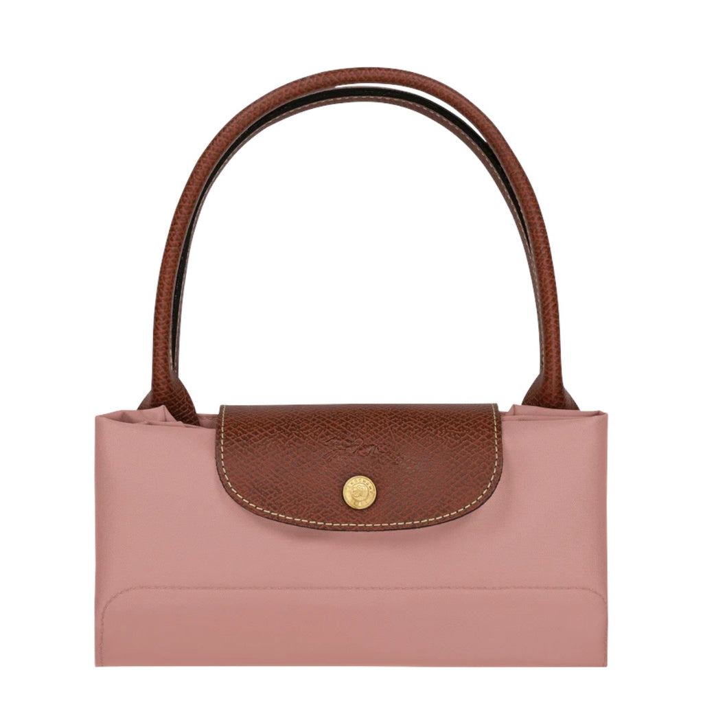 Lieblingstasche Le Pliage L handbag in pink nylon with brown leather trim and handles. Features a snap closure.