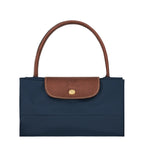 Lieblingstasche Le Pliage L navy blue nylon handbag with brown leather trim and handles.