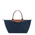 Lieblingstasche Le Pliage L navy nylon tote bag with brown leather trim and handles.