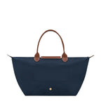 Lieblingstasche Le Pliage L navy nylon tote bag with brown leather handles and trim.