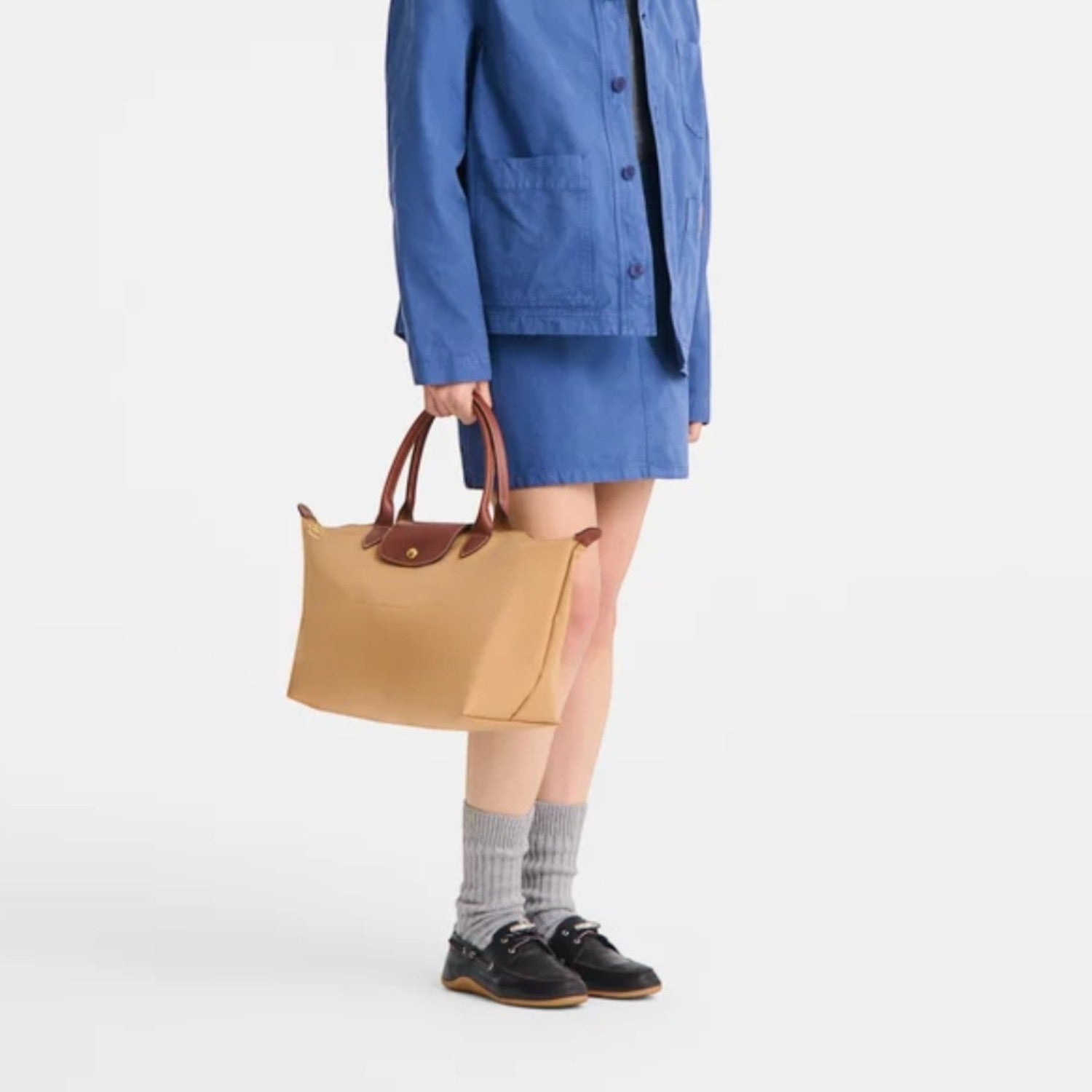 Lieblingstasche Le Pliage L handbag in tan nylon with brown leather handles and trim.