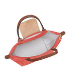Lieblingstasche Le Pliage M coral nylon shoulder bag with brown leather trim and handles, snap closure.