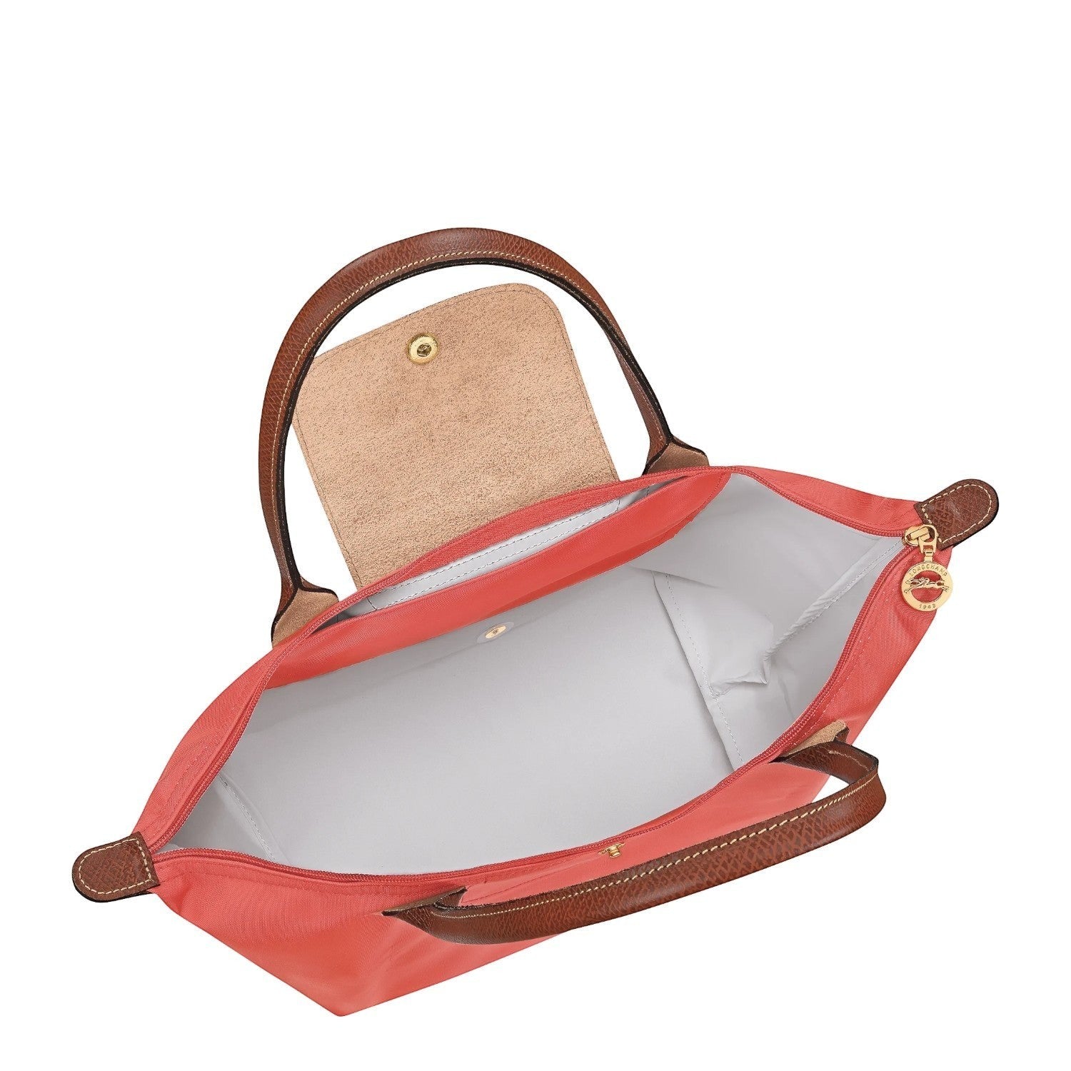 Lieblingstasche Le Pliage M coral nylon shoulder bag with brown leather trim and handles, snap closure.