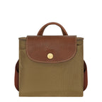 Lieblingstasche Le Pliage rucksack in olive green nylon with brown leather flap and gold snap button closure.