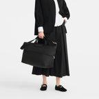 Lieblingstasche Le Pliage One black nylon travel bag with leather trim and shoulder strap