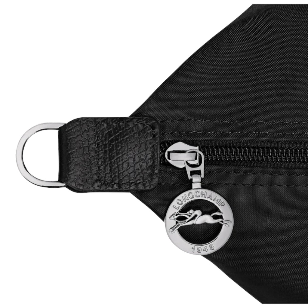Lieblingstasche Le Pliage One black nylon travel bag with leather trim and silver horse logo zipper pull.